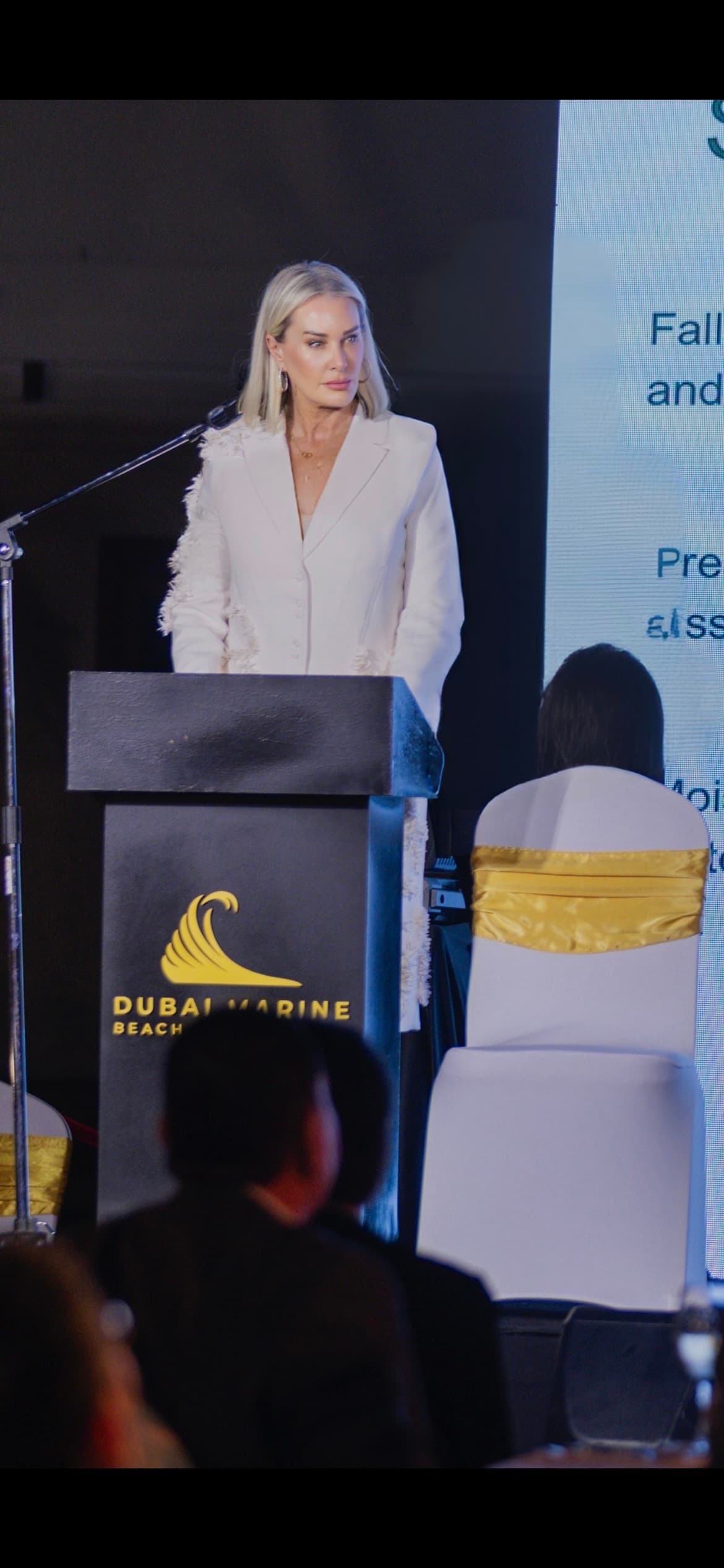 Tara Sillery presenting at a Dubai Marine Beach event